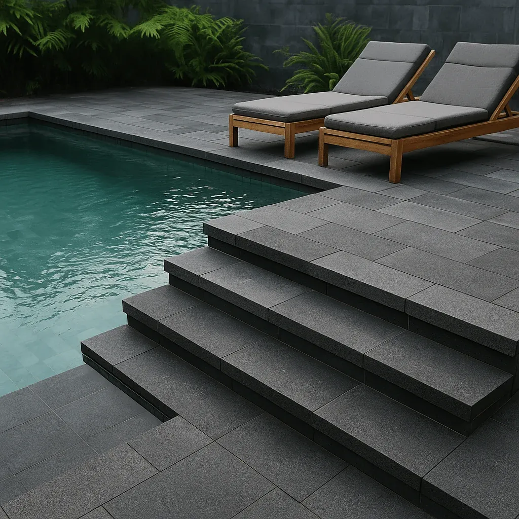 Andesite stone steps and paving around a swimming pool