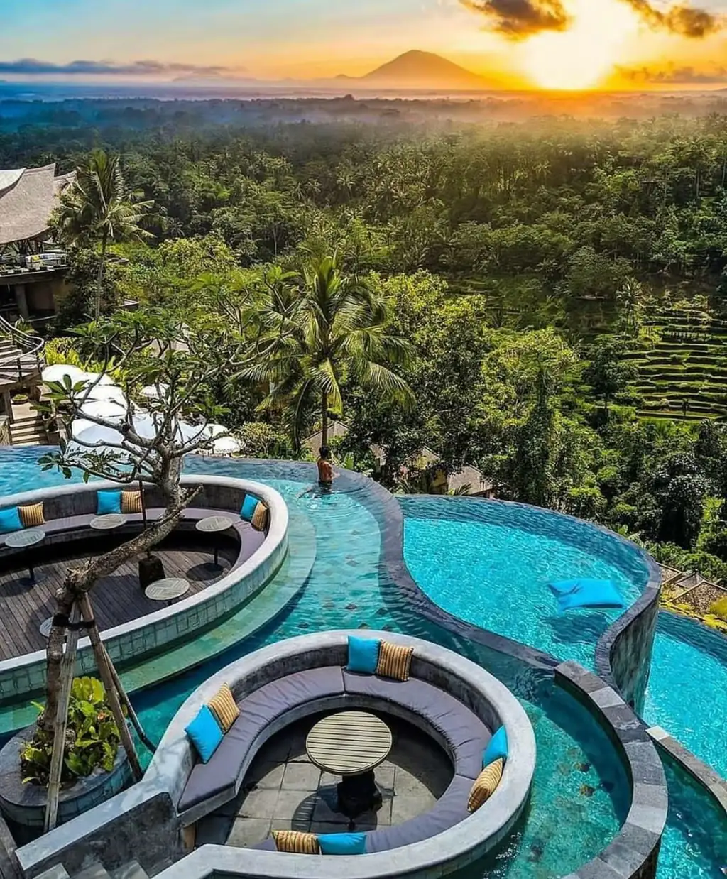 Resort swimming pools with stone clad walls and seating